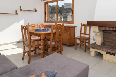 a living room with a table and chairs and a piano at Villas Cap Blanc, 1-31 Cab I-36 in Cullera
