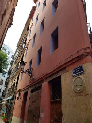 a building with a sign on the side of it at FLORIT FLATS - The Central Market and Lonja Apartment in Valencia