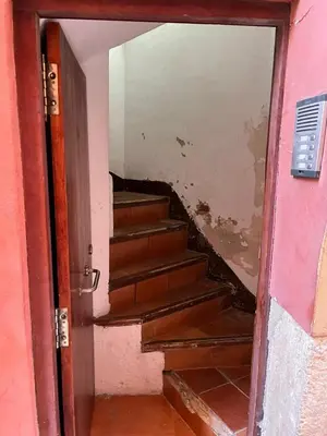 an open door to a room with stairs in it at FLORIT FLATS - The Central Market and Lonja Apartment in Valencia