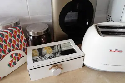 a kitchen counter with a toaster and a box at La Roqueta completo en pleno centro in Valencia
