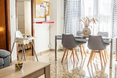 a dining room with a table and chairs at Casa Victoria in Valencia