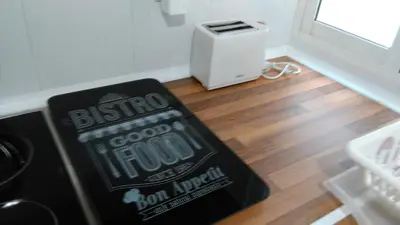 a sign sitting on the floor in a room with at Apartamento Ciudad de las Ciencias 2 in Valencia