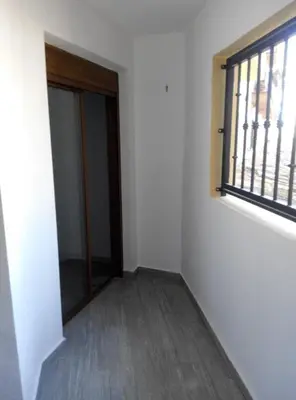 an empty room with a door and a window at Apartment in Little Venice in Port Saplaya