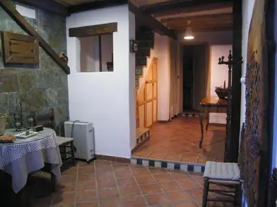a room with a hallway with a table and a door at Casa La Chelva in Alcudia de Veo