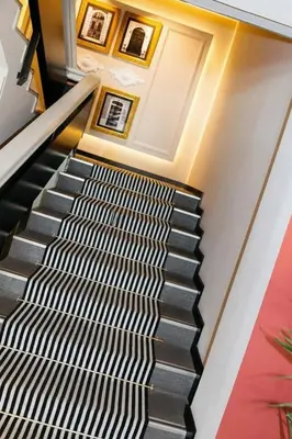 a stairway with a black and white patterned carpet at Sweet Hotel Renasa in Valencia