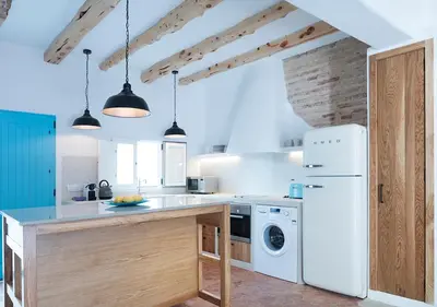 a kitchen with a white refrigerator and a dishwasher at Apartamentos La más Bonita in Valencia