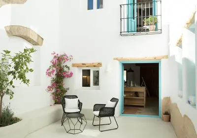 a patio with two chairs and a table at Apartamentos La más Bonita in Valencia