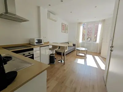 a kitchen with a table and a counter top at Hola Valencia - Holiday Apartments in Valencia