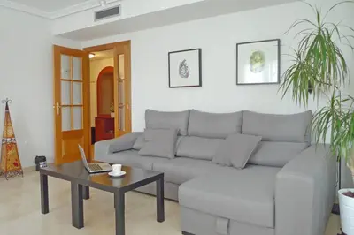 a living room with a couch and a coffee table at Apartamento en la Ciudad de las ciencias in Valencia