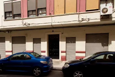 two cars parked in front of a building at MD Oliag in Valencia