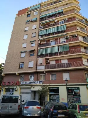 a tall building with cars parked in front of it at Apartamento Turistico en Valencia in Valencia