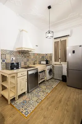 a kitchen with a refrigerator and a sink at Live in Chianti Apartaments by Concept Flats in Valencia