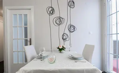 a white table with chairs and a vase on it at Apartamento valencia centro in Valencia
