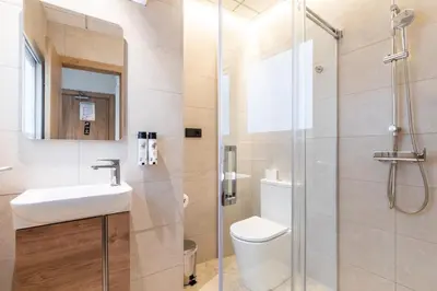a bathroom with a toilet and a sink and a shower at Nommadas Jero - Only Adults in Valencia