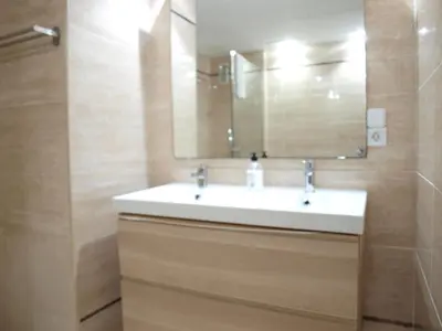 a bathroom with a white sink and a mirror at ApartUP Patacona Attic I in Valencia