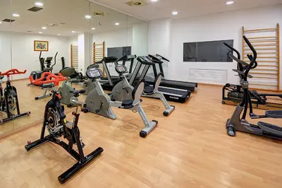 a gym with a bunch of exercise bikes in it at Hotel Vila-real Palace in Villareal