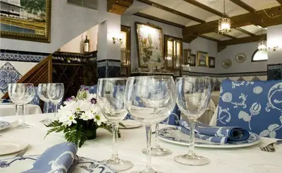 a table with empty wine glasses on it at Casa Quiquet in Beniparrell