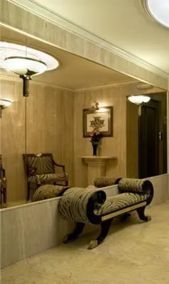 a living room with a zebra chair and a mirror at Casa Quiquet in Beniparrell