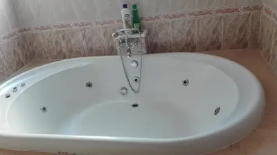 a white bath tub in a bathroom at Hostal Andrés in El Saler