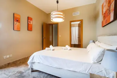 a bedroom with a large white bed in a room at Exclusive Museum in Valencia