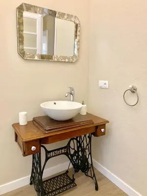 a bathroom with a sink and a mirror at Hi Valencia Canovas in Valencia