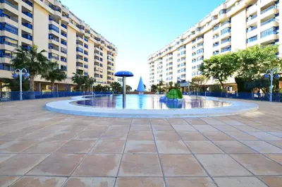 a large fountain in the middle of a courtyard at Apartamento frente al mar in Valencia