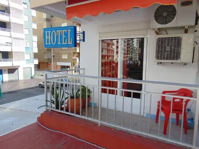 a hotel with a sign on the side of a building at Hotel Libertador in Cullera