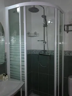 a bathroom with a shower and a sink at Hotel Libertador in Cullera