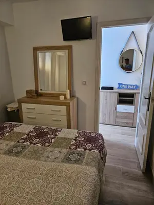 a bedroom with a bed and a big screen tv at 
