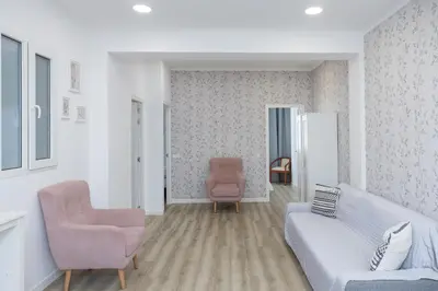 a kitchen with a table and chairs and a refrigerator at Una Ubicacion Perfecta in Valencia