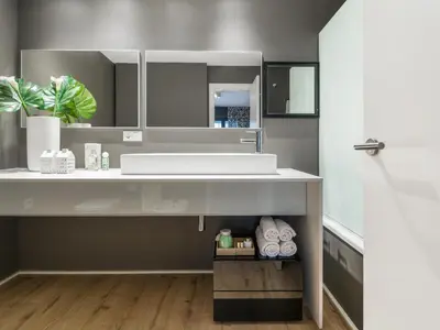 a bathroom with a sink and a mirror at Flat El Porto - Valencia in Valencia