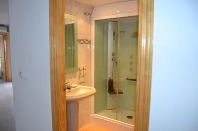 a bathroom with a shower and a sink at Apartamento Con Preciosas Vistas Al Mar,WIFI y piscina de temporada in Canet de Berenguer