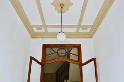 a ceiling with a chandelier in a room at Hola Valencia - Holiday Apartments in Valencia