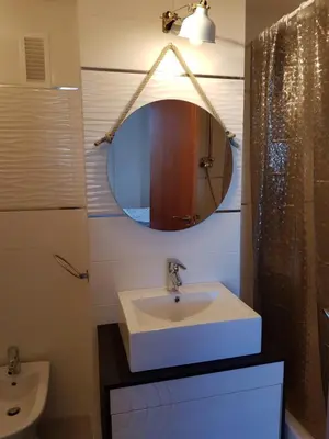 a bathroom with a sink and a mirror at River Park Valencia in Valencia