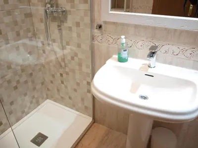 a bathroom with a sink and a shower at ApartUP Patacona Beach II in Valencia