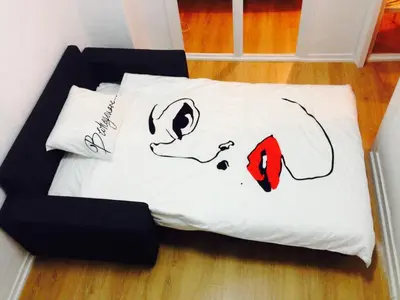 a bed with a dog drawn on it at Valencian Dreams in Valencia