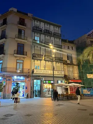 a building with a street light in front of it at Hospederia del Pilar in Valencia