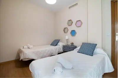 a bedroom with a bed with two towels on it at La Seda Stay in Valencia