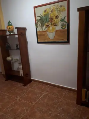 a painting on a white wall with a tiled floor at Casa Pueblo Alzira No Compartida in Alzira