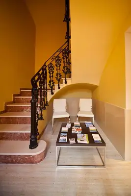 a room with two chairs and a table and stairs at RealRent Marina Real in Valencia