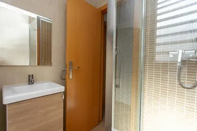 a bathroom with a sink and a shower at 4-Seasons Penthouse Cullera in Cullera