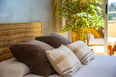 a group of pillows sitting on top of a bed at 4-Seasons Penthouse Cullera in Cullera