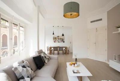 a living room with a couch and a table at SingularStays Santa Clara in Valencia