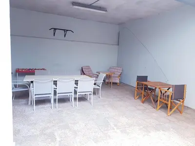 a dining room with chairs and a table and tables at Casual House Valencia in Valencia