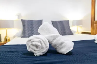 a rolled up towel on top of a bed at My Loft 4 You Temple in Valencia