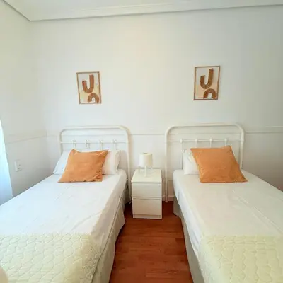 two beds sitting next to each other in a room at Travel Habitat Mestalla in Valencia