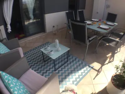 a view of a living room with a table and chairs at WONDERFUL APARTMENT IN CANET DE BERENGUER. VALENCIA in Valencia
