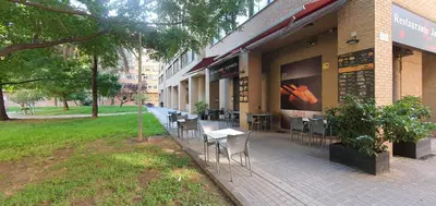 a group of tables and chairs outside of a building at A123 ViviendaTuristicaValencia Grandes Grupos in Valencia
