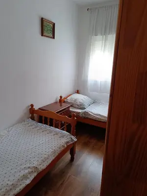 a small room with two beds and a window at Burriana in Burriana