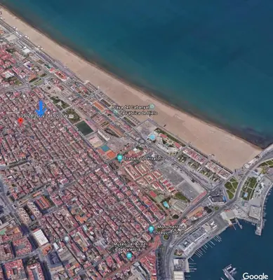 a map of a city next to a beach at La casita azul de la playa in Valencia